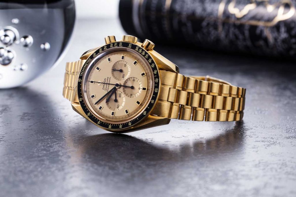 1969 Yellow Gold Omega Speedmaster Tribute to Apollo XI Reference BA 145.022 with a black service bezel insert, property of Wei Koh (© Revolution)