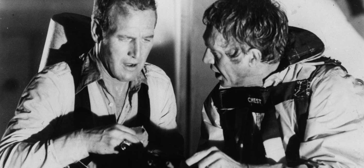Paul Newman and Steve McQueen get ready to blow up water storage tanks in a scene from the film 'The Towering Inferno', 1974. (Photo by 20th Century-Fox/Getty Images)