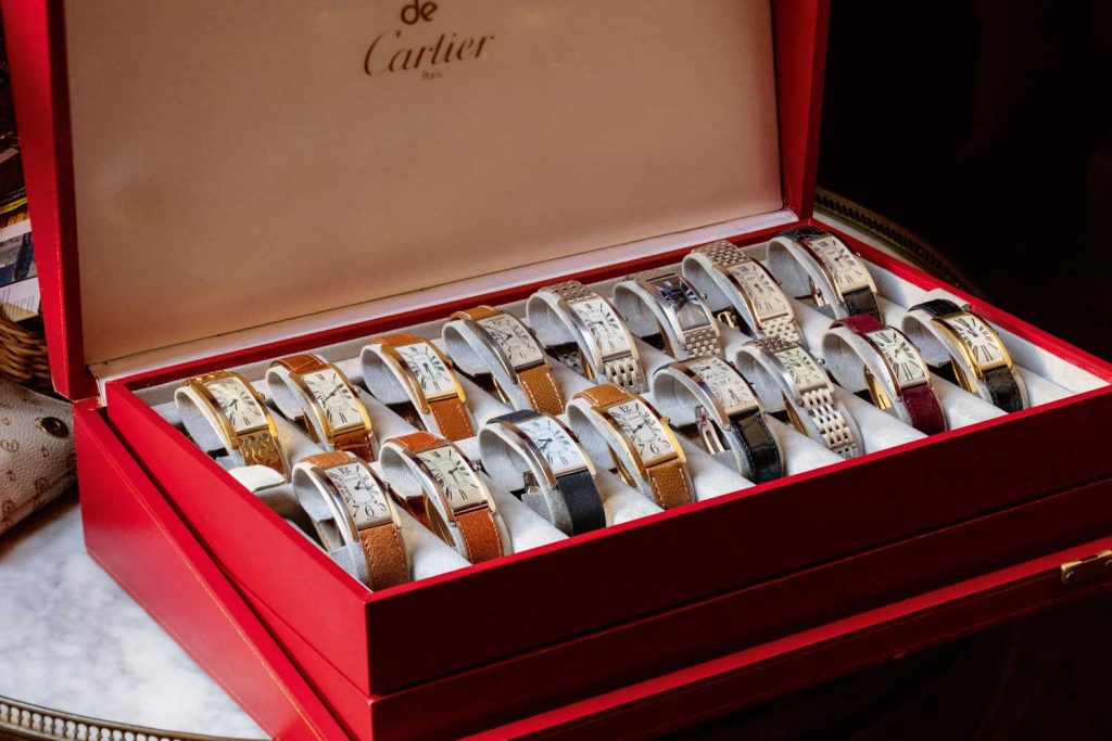 Some of Auro Montanari’s Tank Cintrées, in a Cartier box, showing the evolution of the watch line (©Revolution)