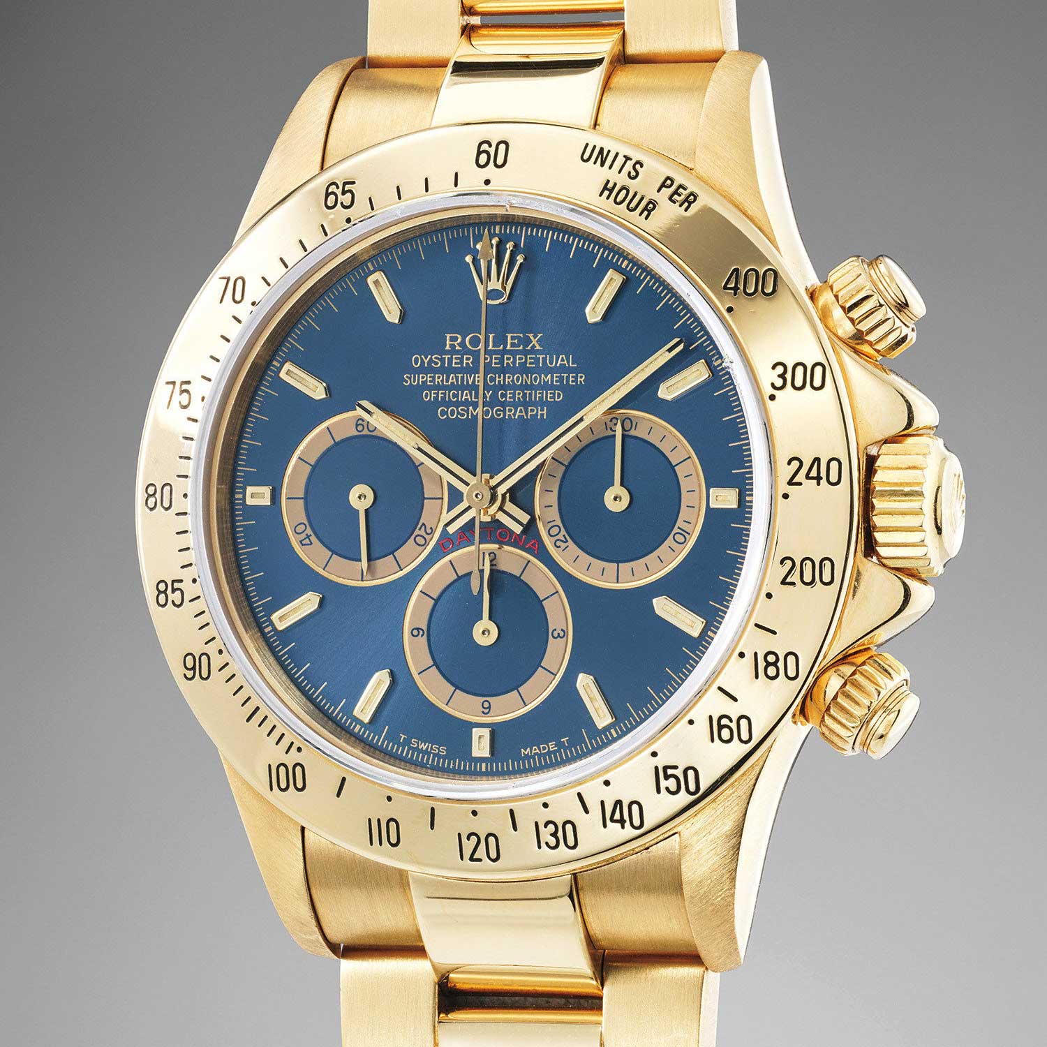 Lot 173: Rolex Ref. 16528. An extremely rare and highly attractive yellow gold chronograph wristwatch with blue dial and bracelet