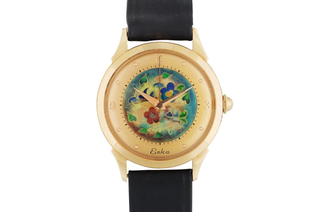 Lot 454: Eska. Pink gold wristwatch with cloisonné enamel dial, circa 1950