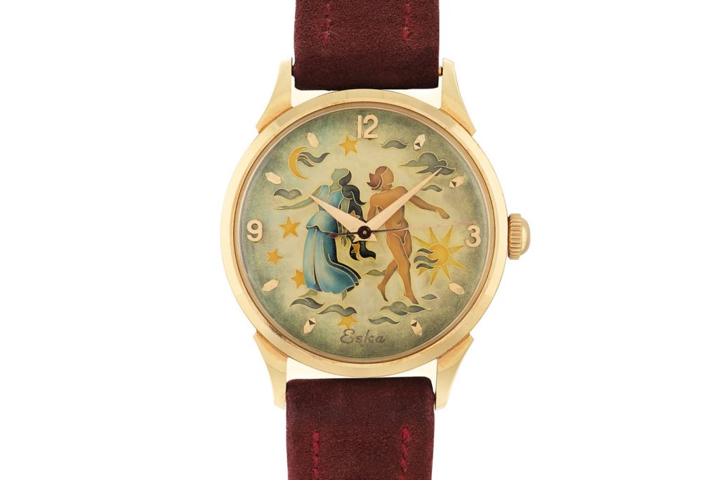 Lot 455: Eska. Pink gold wristwatch with cloisonné enamel dial, circa 1950