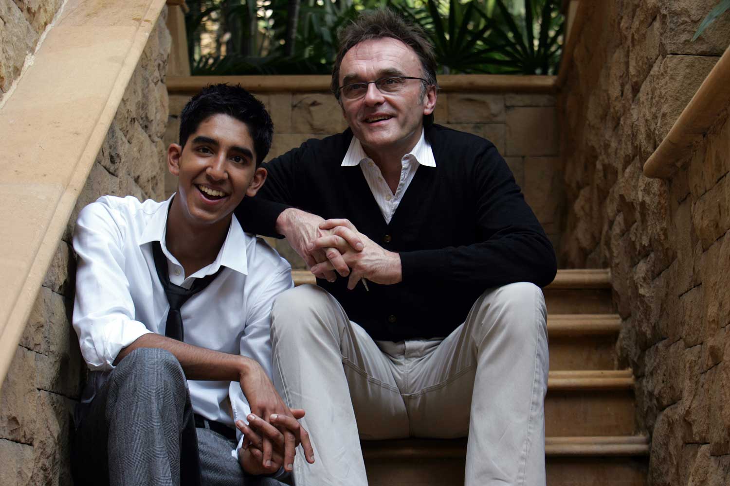 A teenage Dev Patel with Slumdog Millionaire director Danny Boyle in 2008.