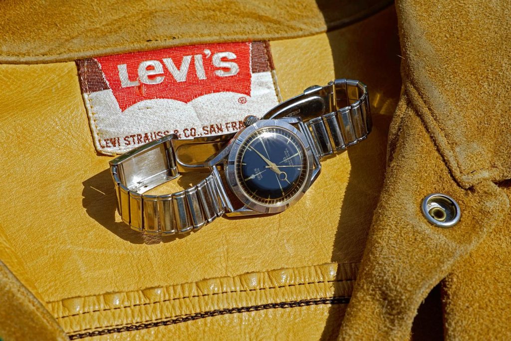 Steel self winding Gruen 23 Precision, Power-Glide with black gilt dial and ridged bezel, 1958. Vintage suede Levi’s jacket, ’60s