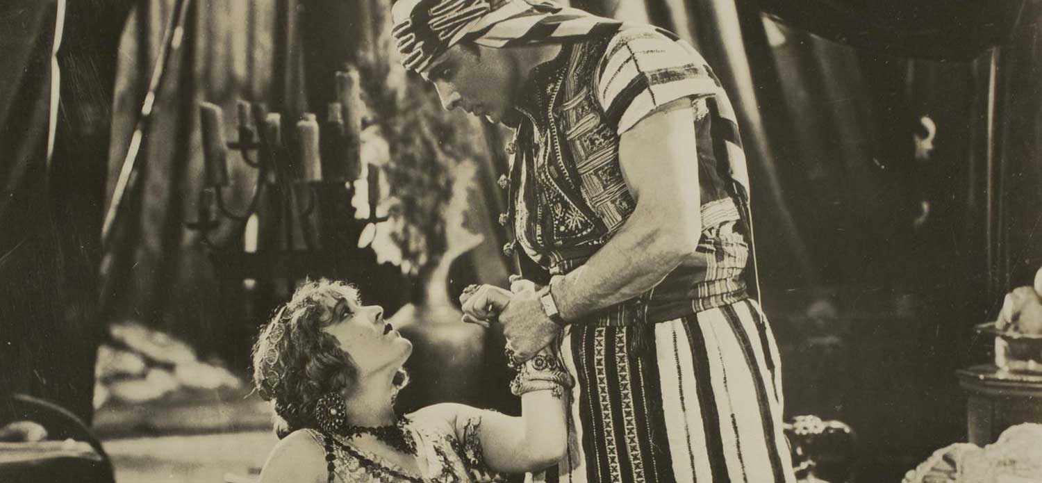 Vilma Banky and Rudolph Valentino in the 1926 film, Son of the Sheik; Valentino insisted on wearing his treasured Cartier Tank during the filming. In every scene.