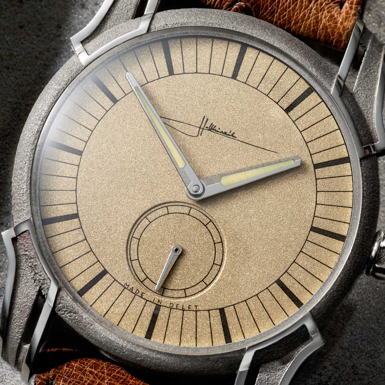 A close up of the Holthinrichs Watches RAW Ornament - Pale Gold - beautifully frosted satin finish dial