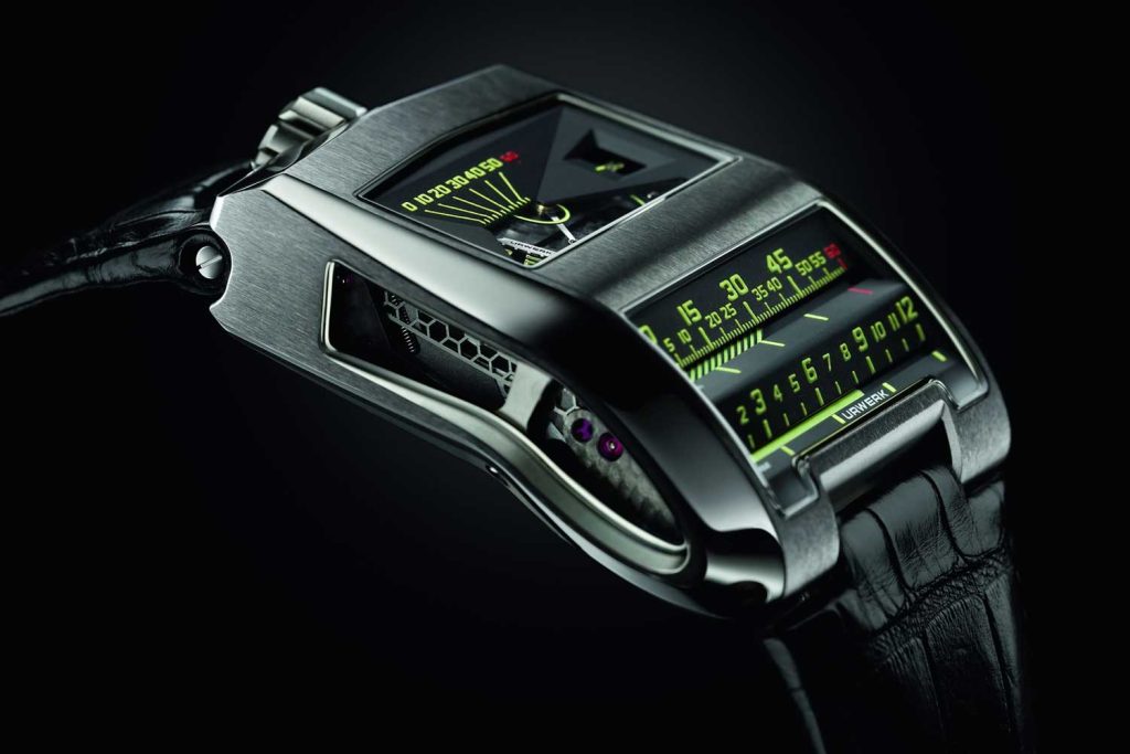 URWERK’s UR-CC1, with a linear display of seconds, minutes and jumping hours, all coordinated by the use of a vertical triple cam.