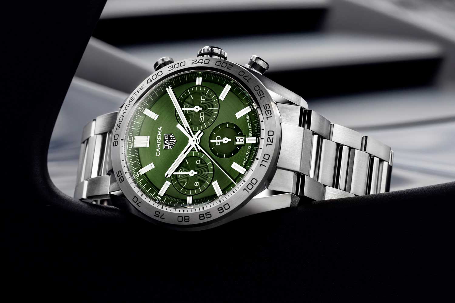 TAG Heuer Carrera Sport Chronograph 44m seen here in the green dial variation which has a steel bezel with its tachometer etched directly on the surface