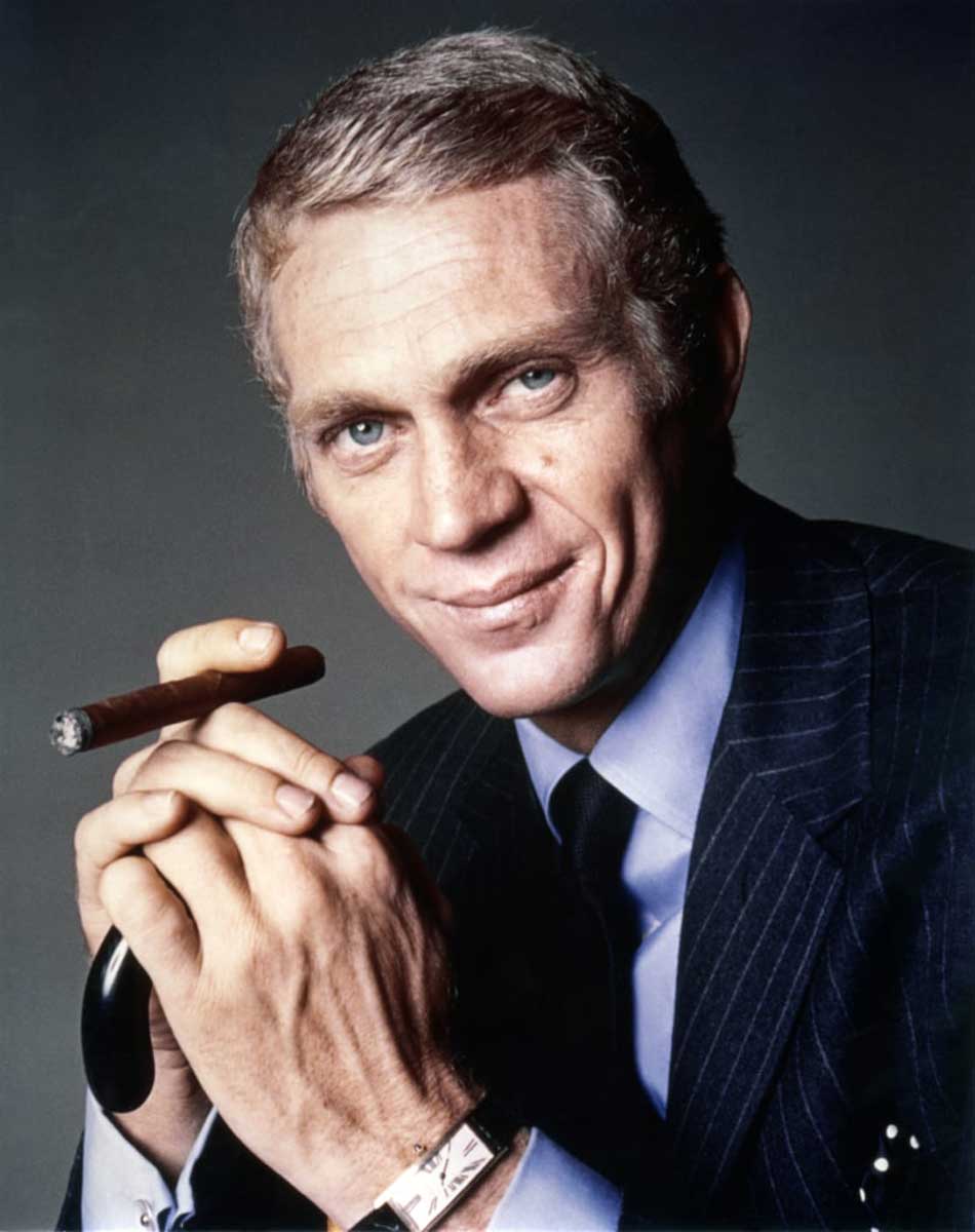 Steve McQueen wearing the Cartier Tank Cintrée in a promotional photo for the Thomas Crown Affair