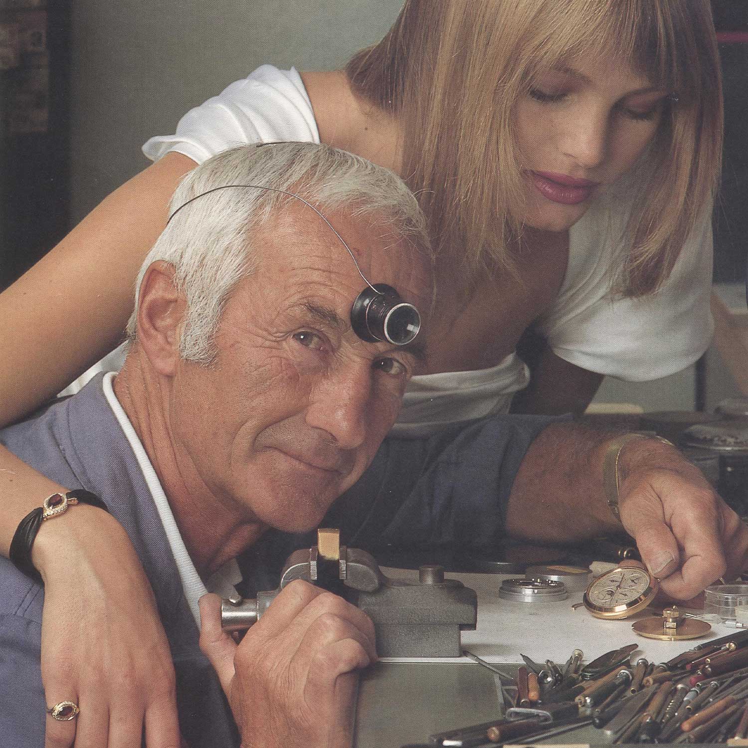 Michel Rochat at his watchmaker's desk with Spanish singer, Dias de Verano; circa 1990