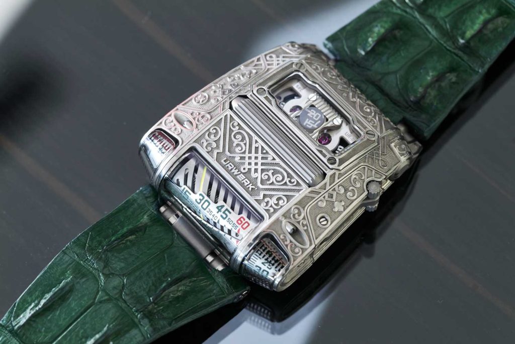 Santa Laura’s collection of URWERK pièces unique engraved by Florian Güllert, the EMC, 210 and 111; the UR-111 is even made with personalized green numerals (©Revolution)