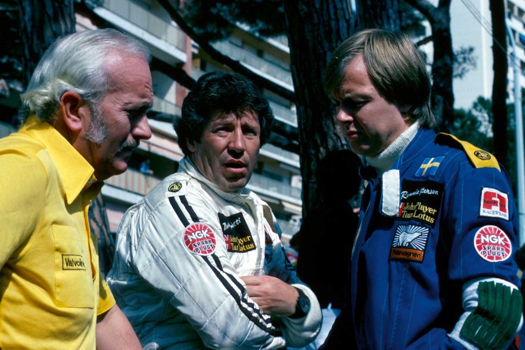 The legendary Formula 1 pilot Mario Andretti (middle) wearing the Orfina Porsche Design Chronograph 1. (Image: Getty Images)