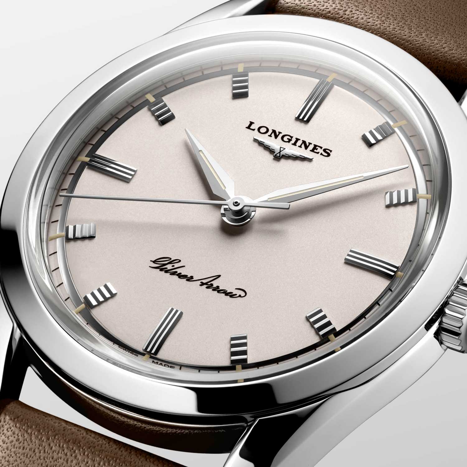 The watch features a stepped dial, vintage style hour markers and sharply edged hour and minute hands