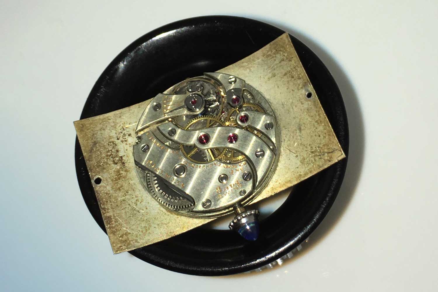 The underside of the circa 1930s Tank Cintrée showing how the movement is placed in the recess of the curve of the watch's dial © bonhams.com