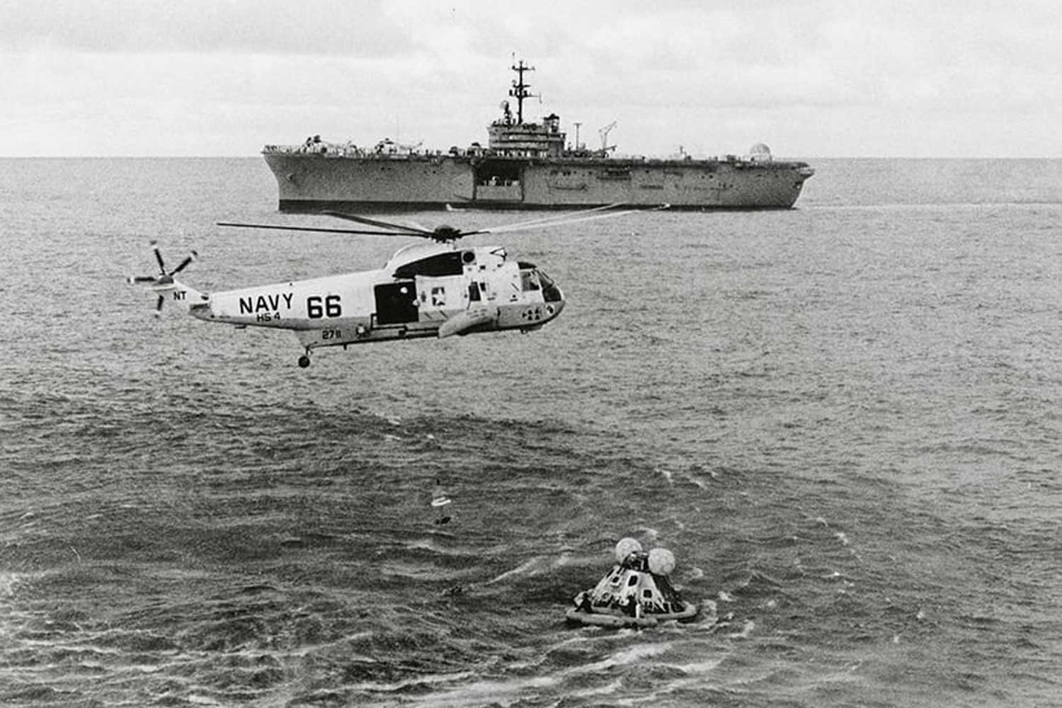 The Apollo 13 crew was recovered by the Iwo Jima ship seen in the backdrop here.