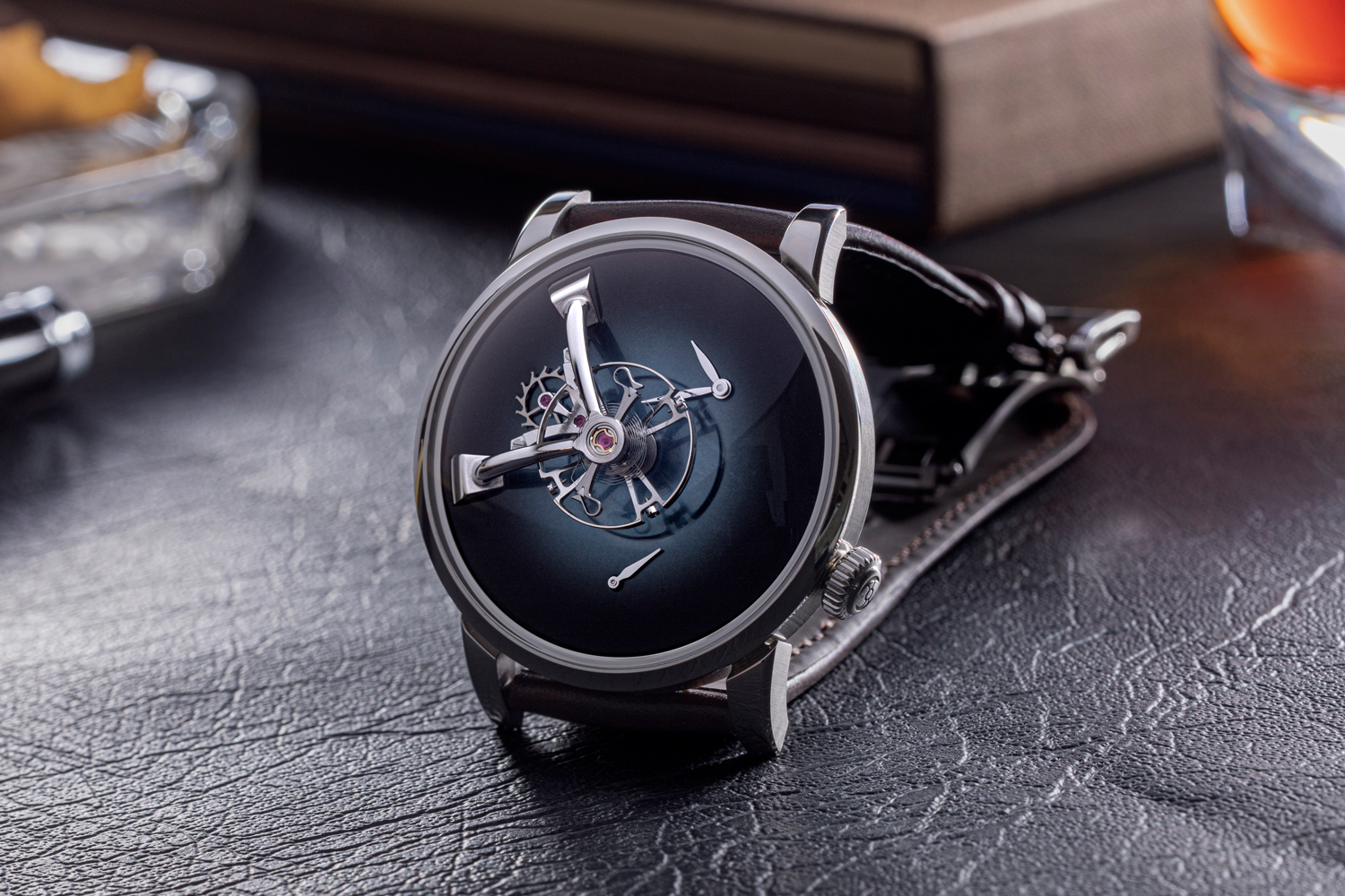 The LM101 MB&F x H. Moser, a collaboration between the two brands takes on H. Moser’s “back to basics” approach embodied in its Concept watch series with the MB&F logo omitted from the dial; the floating time and power reserve subdials have been removed, thanks to hands placed directly on the main dial, allowing to fully express the fumé dials borrowed from H. Moser & Cie; the watch is topped with a domed sapphire crystal, the cases for the LM101 MB&F x H. Mose were made of steel, which is unusual for MB&F (©Revolution)