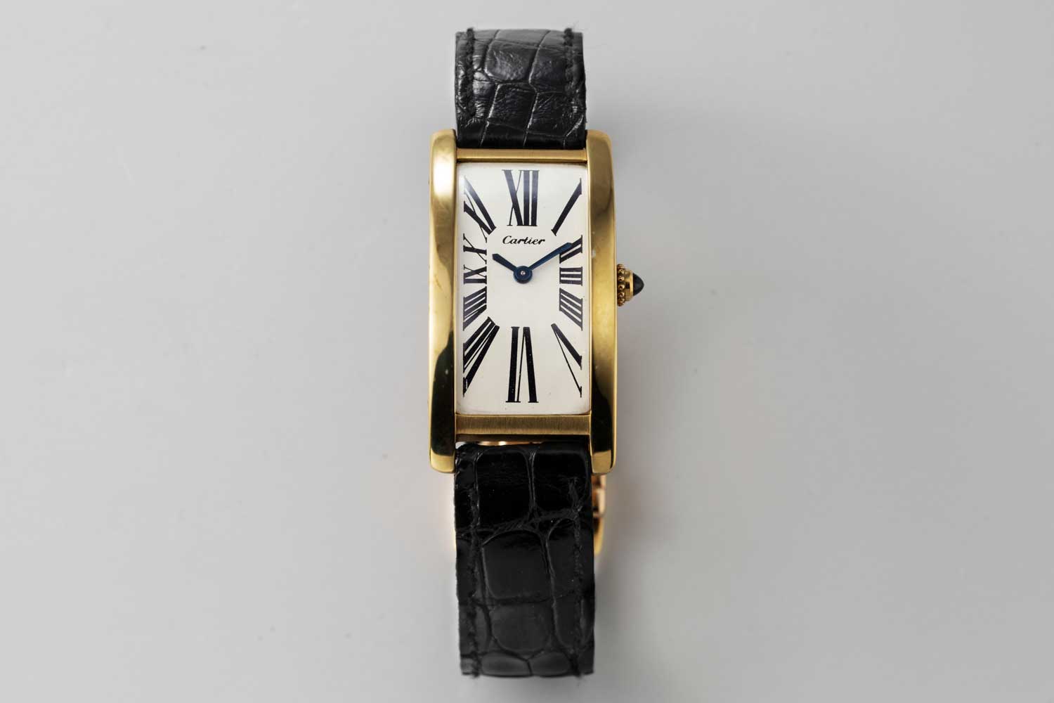 A 9-lignes, 1969 London Cartier Tank Cintrée; dial of the watch has a design which features serif Roman numerals that almost seem to explode from the center of the dial and reach for the edge of the case with a thrilling vibrancy; this particular example is from the private collection of Auro Montanari (©Revolution)