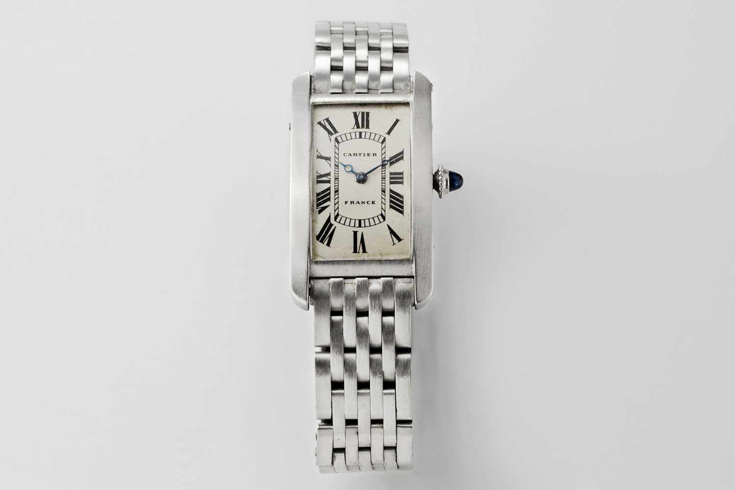 1930 Cartier Platinum Tank Cintrée made in France, medium size with original pt. 7-link bracelet; this particular example is from the private collection of Auro Montanari (©Revolution)