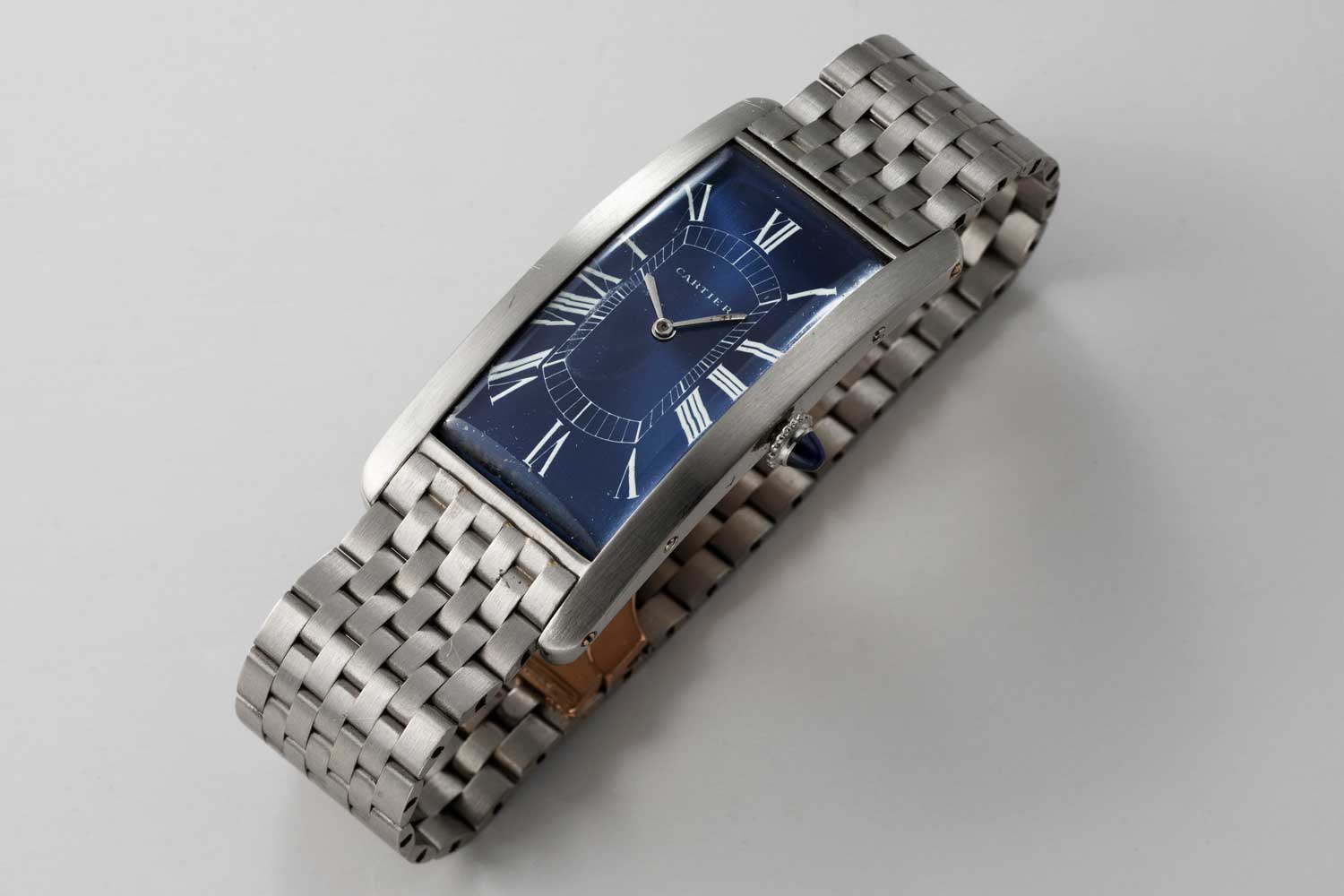 1929 platinum Cartier Paris Tank Cintrée with European Watch movement; In the middle of the 1990s a special order was made with Paris for a new blue dial with white Roman numerals, ie the dial placed in the case at the moment is not the same one from 1929; this particular example is from the private collection of Auro Montanari (©Revolution)