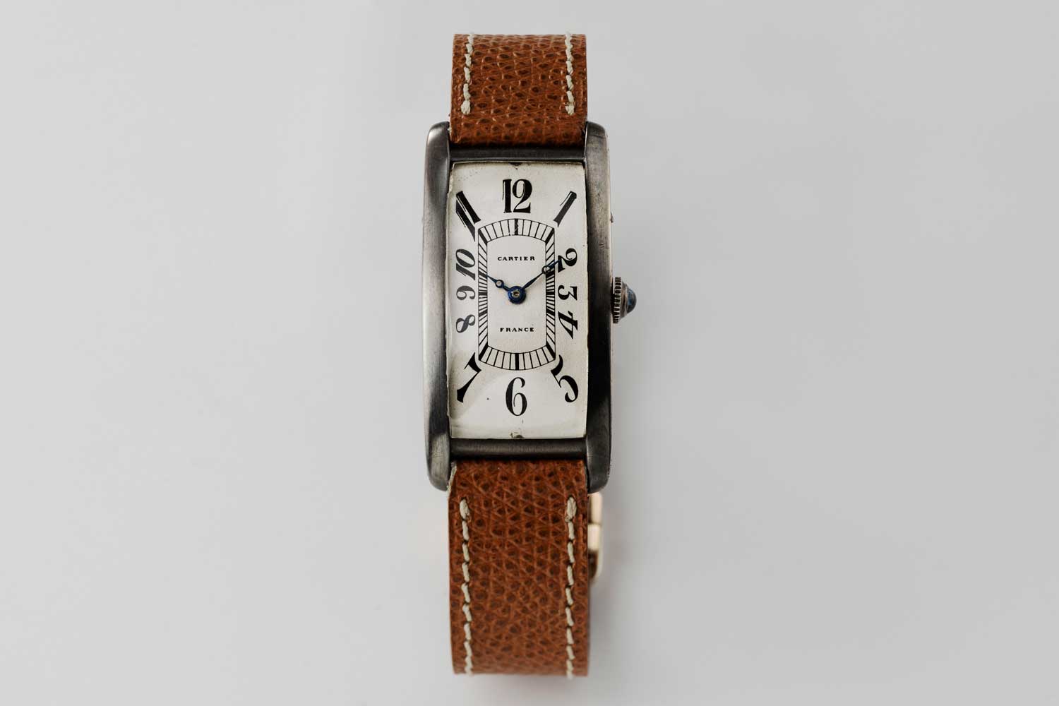 1926 made in France Cartier Tank Cintrée, possibly pièce unique with a silver case and elongated Arabic numerals; powered by a European Watch movement; this particular piece is from the private collection of Auro Montanari (©Revolution)