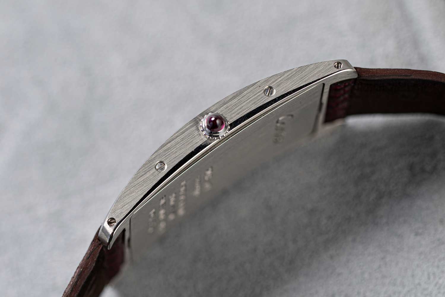 Wei Koh’s special order Cartier Tank Cintrée in platinum with a salmon dial and burgundy Roman numerals, fitted on a burgundy lizard strap made by Federico De Peppo of Huitcinq1988 (©Revolution)