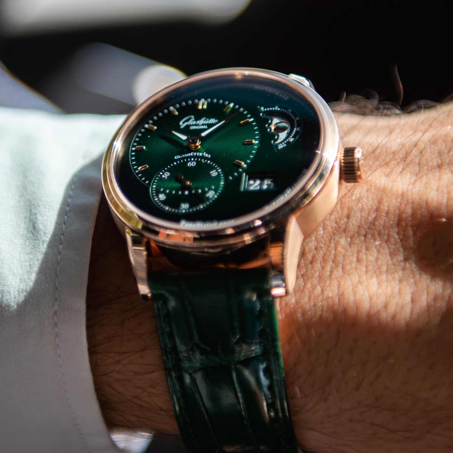 The dial is an intense dark green in the center and gradually changes to black at the edges