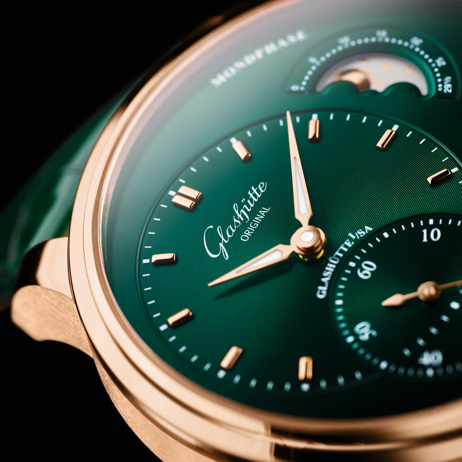 The combination of red gold case with forest green dial makes a head turner.