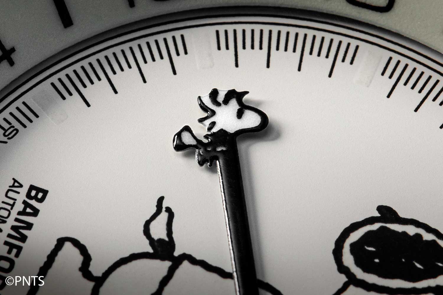 Snoopy’s buddy Woodstock also makes an appearance on the dial, perched at the tip of the GMT hand. (©Revolution)