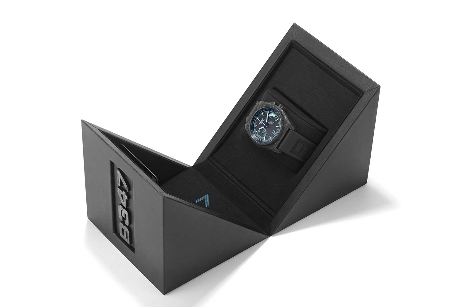 The Bamford B347 comes in an embossed black inner box and aqua outer box.