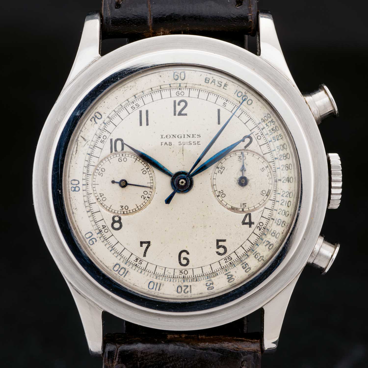 The original “Fab Suisse” dial is white with a tachymeter scale.