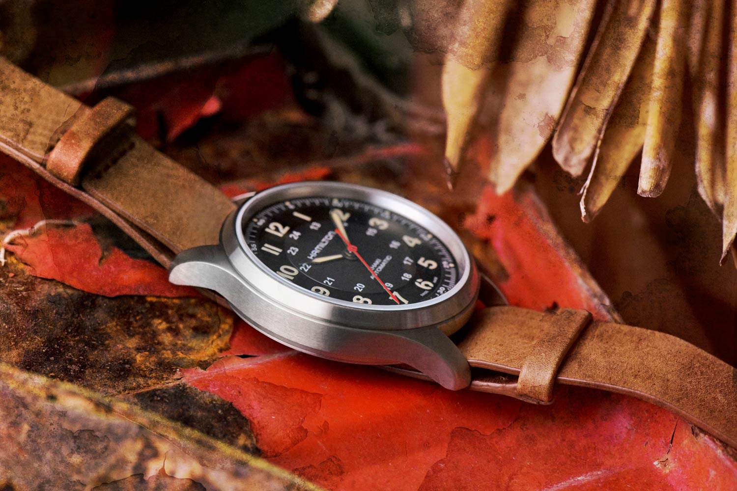 The 42mm Hamilton Field Watch features a brushed titanium case, black vinyl dial with a matte center and a red seconds hand, intended as a tribute to Yara’s guerilla forces.