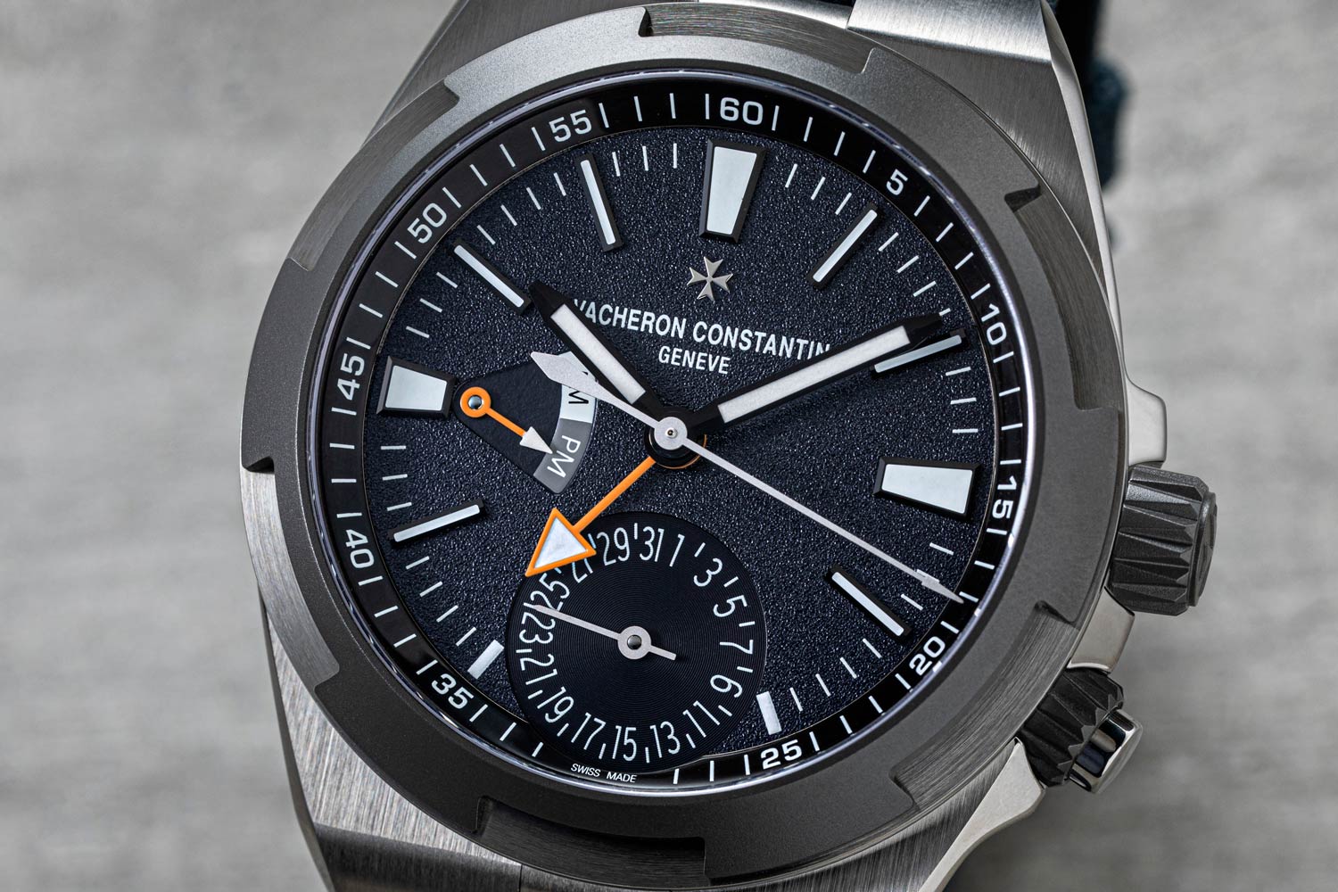 Limited to 150 pieces of each, the Everest Overseas models are titanium versions of the existing steel models with gorgeous grey-blue grained dials, orange accents, and Cordura fabric straps. (© Revolution)