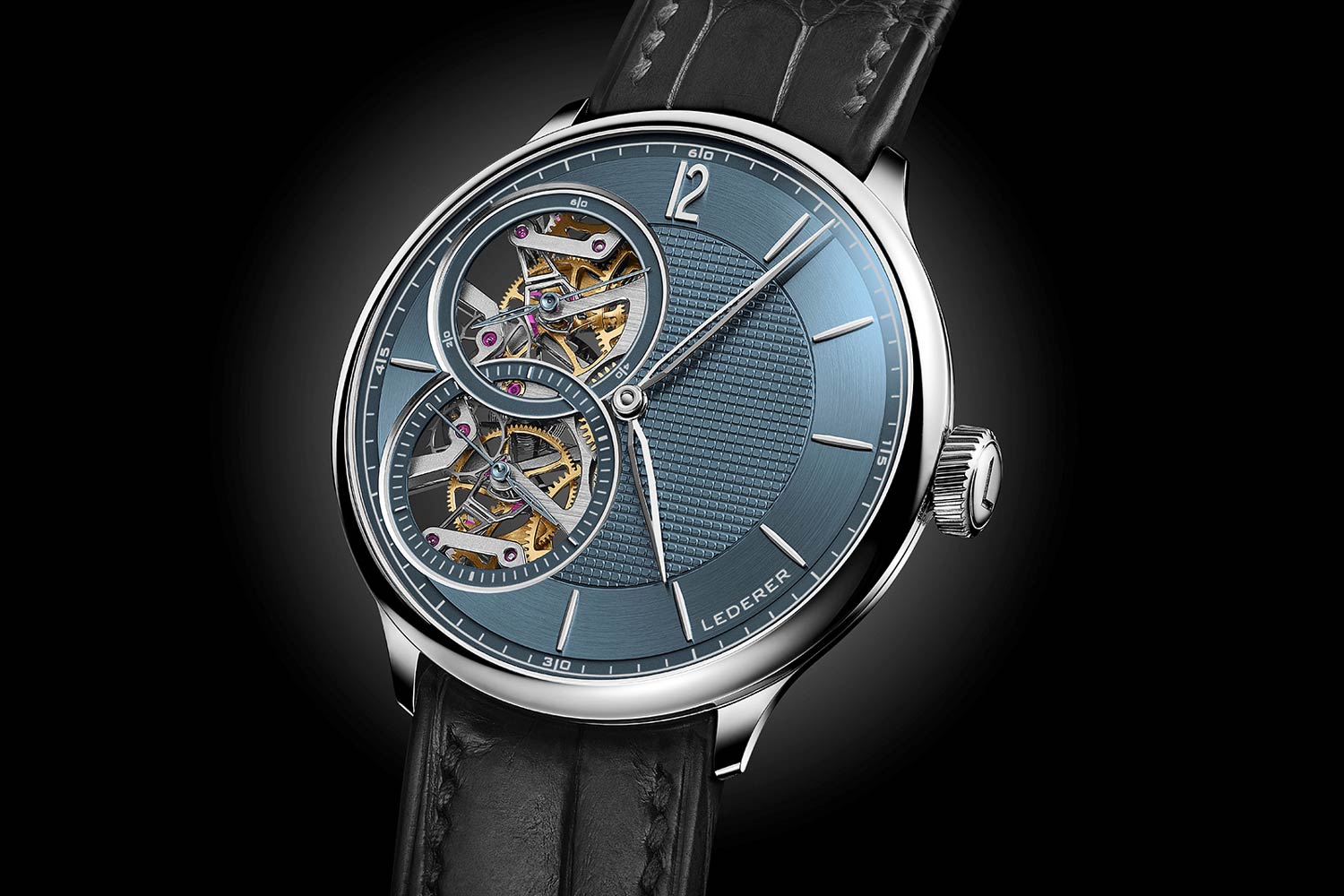 The dial features an engine-turned middle with a concentrically brushed chapter ring