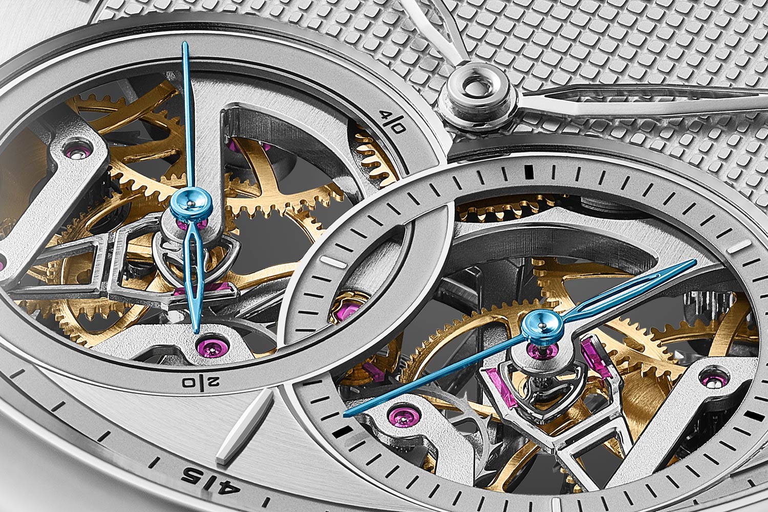 The technical highlights of the movement are exposed on the dial through a pair of seconds apertures