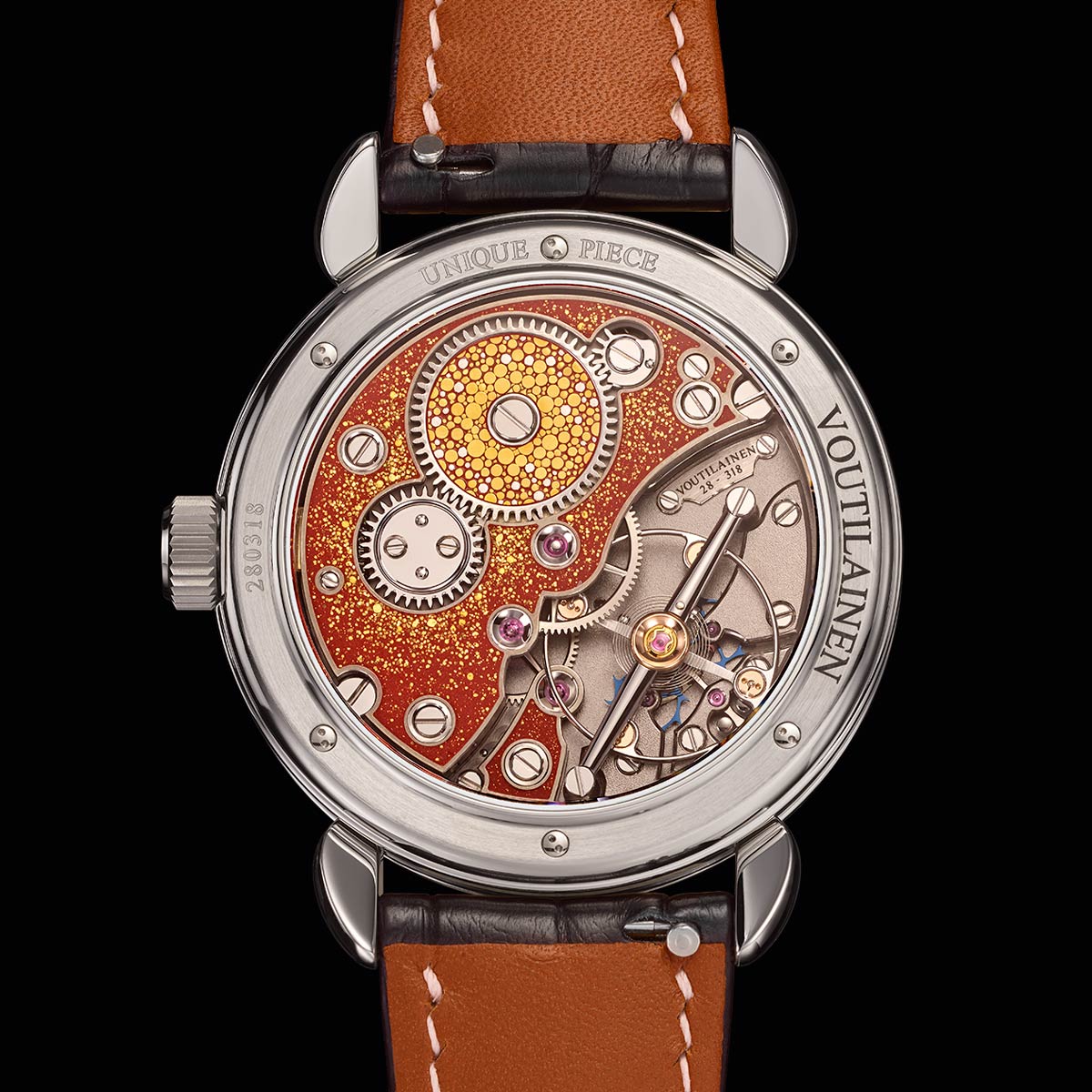 Voutilainen’s in house designed movement here shows in plain sight, his use of a free sprung balance (wheel diameter 13.60mm) with Grossman interior curve and Philips exterior curve, beating at 18'000 vph; coupled with two escapement wheels