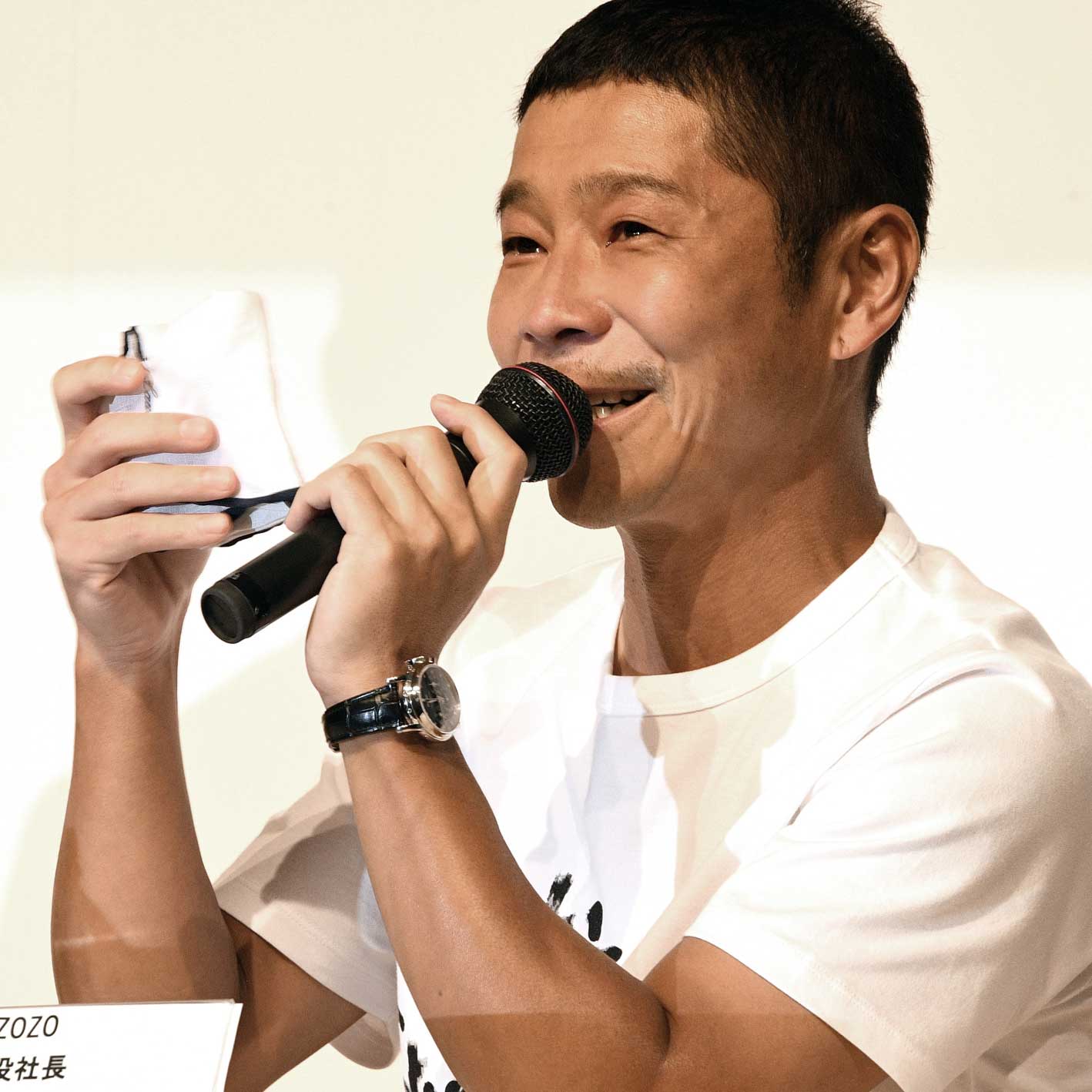 Yusaku Maezawa at the press conference announcing the selling of his stake in Zozo Inc. in 2019, wearing a Patek Philippe 3970EP perpetual calendar chronograph