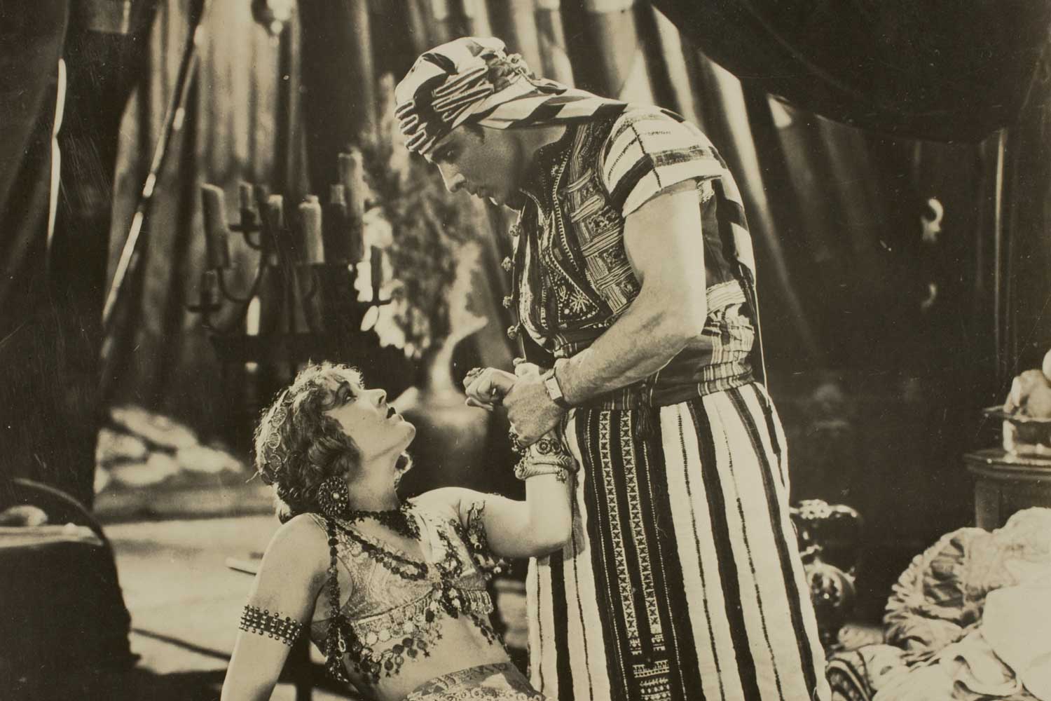 Vilma Banky and Rudolph Valentino in the 1926 film, The Son of the Sheik. Valentino insisted on wearing his treasured Cartier Tank during the filming