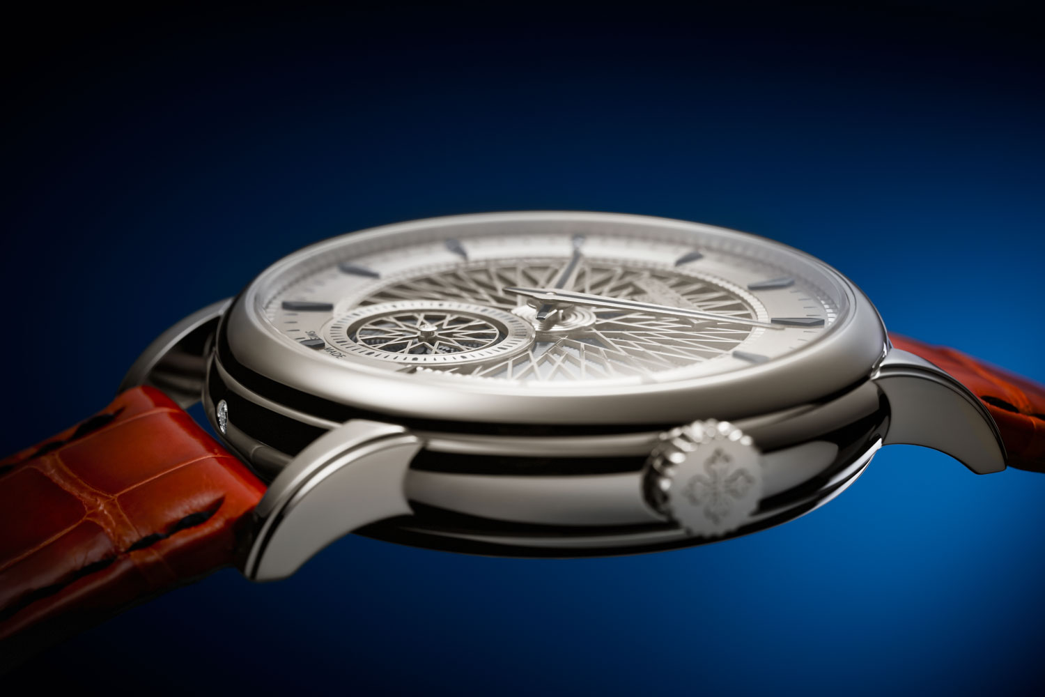 The sound produced by the Ref. 5750 Patek Philippe “Advanced Research” Minute Repeater is first routed to the sound lever and then to the oscillating wafer and subsequently propagated through four openings at 12, 3, 6, and 9 o'clock in a titanium ring; the sound waves exit through a narrow slot between the case back and the case band; a dust filter protects the movement without affecting the sound; the case material does not influence the sound and its propagation regardless of whether the case material is rose, yellow, or white gold or platinum