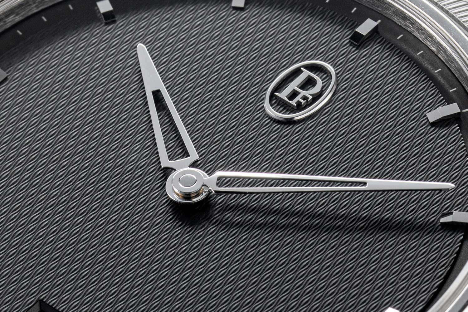 The grey "guilloché grain d'orge" dial, the high polished applied markers and minimalistic PF logo on the Parmigiani Fleurier Tonda PF Micro-Rotor (©Revolution)