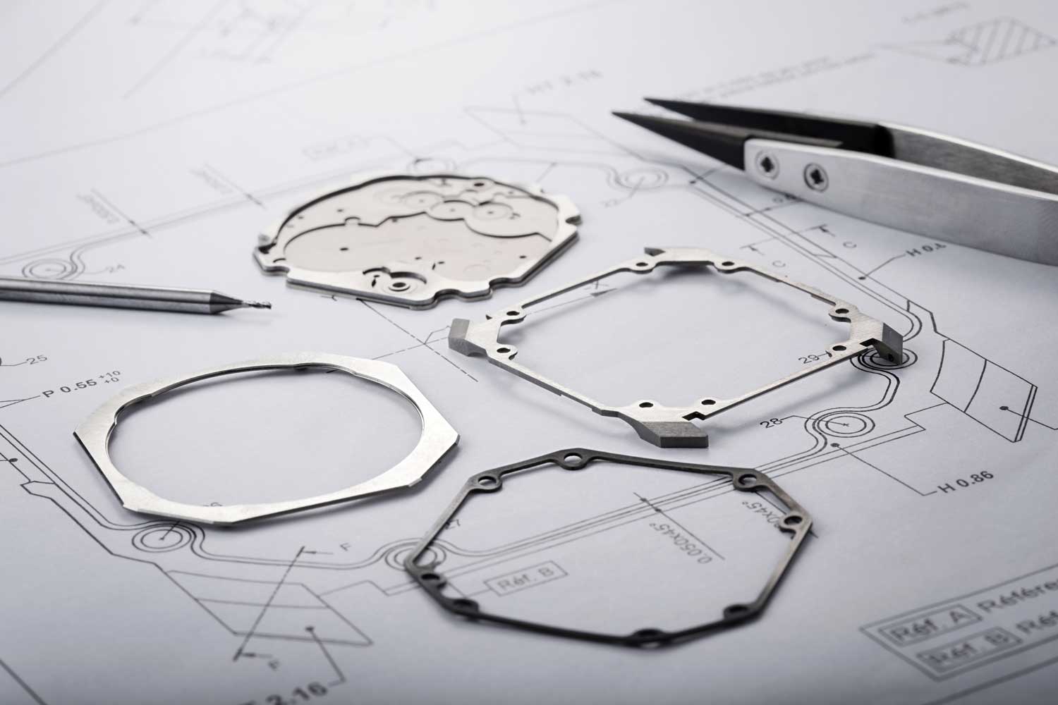The Ultra’s full titanium case dismantled into its component parts. Clockwise from left: bezel, case back which doubles up as the main plate, case-middle with lugs, bezel gasket
