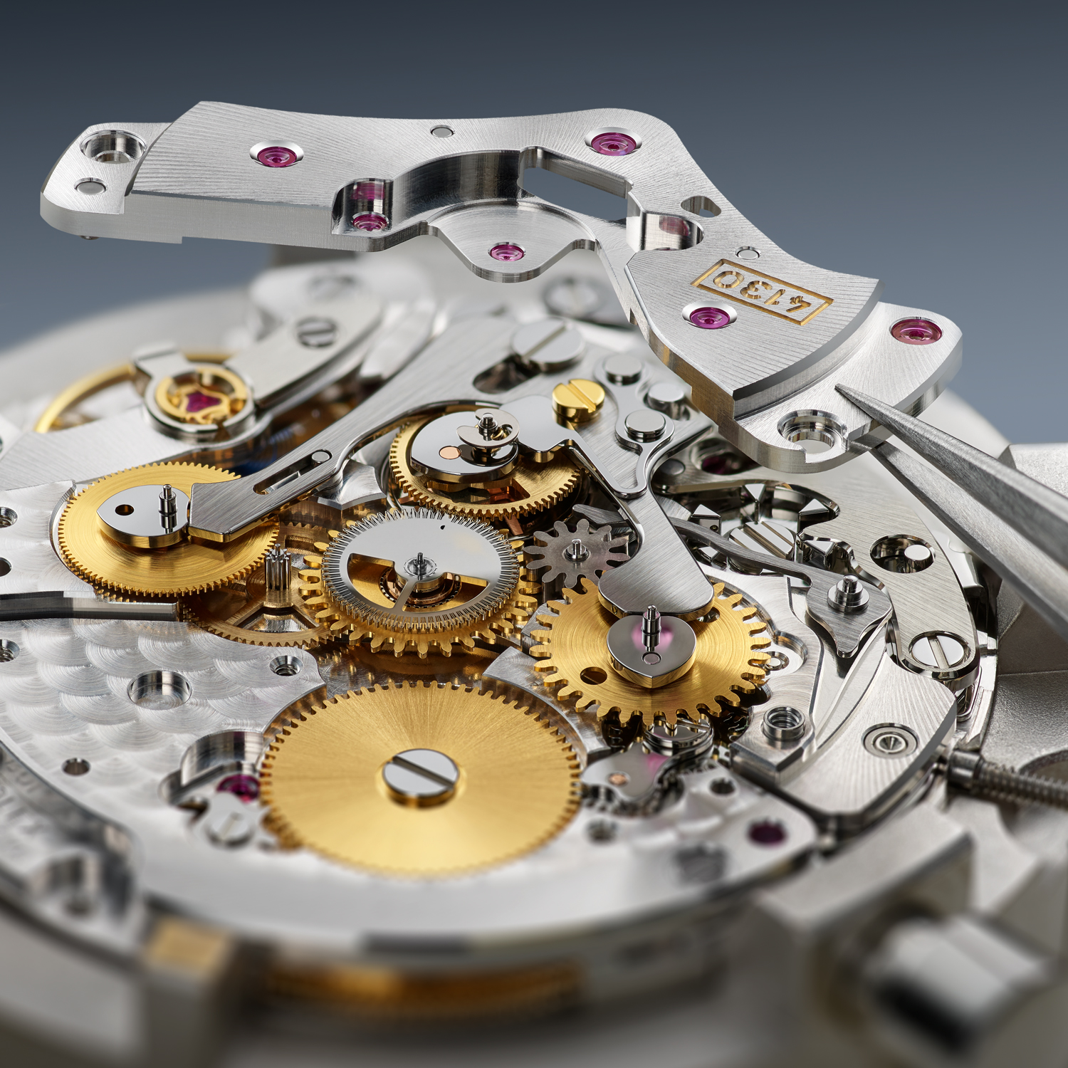 The chronograph wheel train of the caliber 4130. The three wheels placed neatly in a row from L-R: hour counting wheel, chronograph seconds wheel and minute counting wheel. It is the specific positioning of these wheels that gives the subdials room to breathe on the dial. (Image: Rolex)