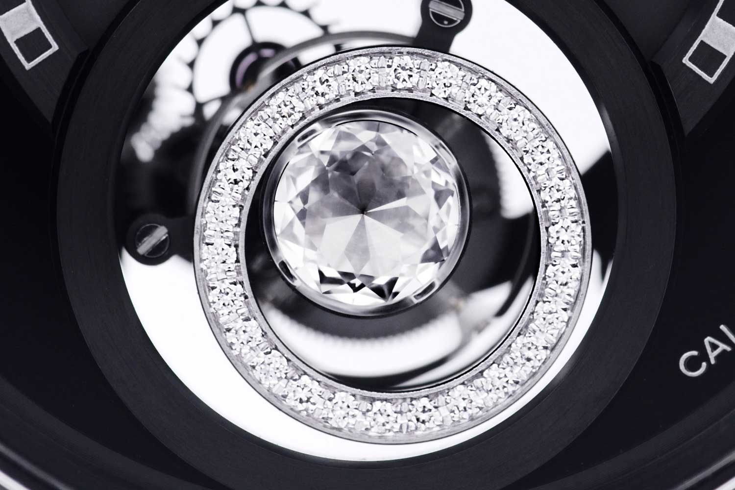 A 0.18-carat solitaire diamond with 65 facets is set at the center of the tourbillon cage that is framed by 26 round brilliant-cut diamonds