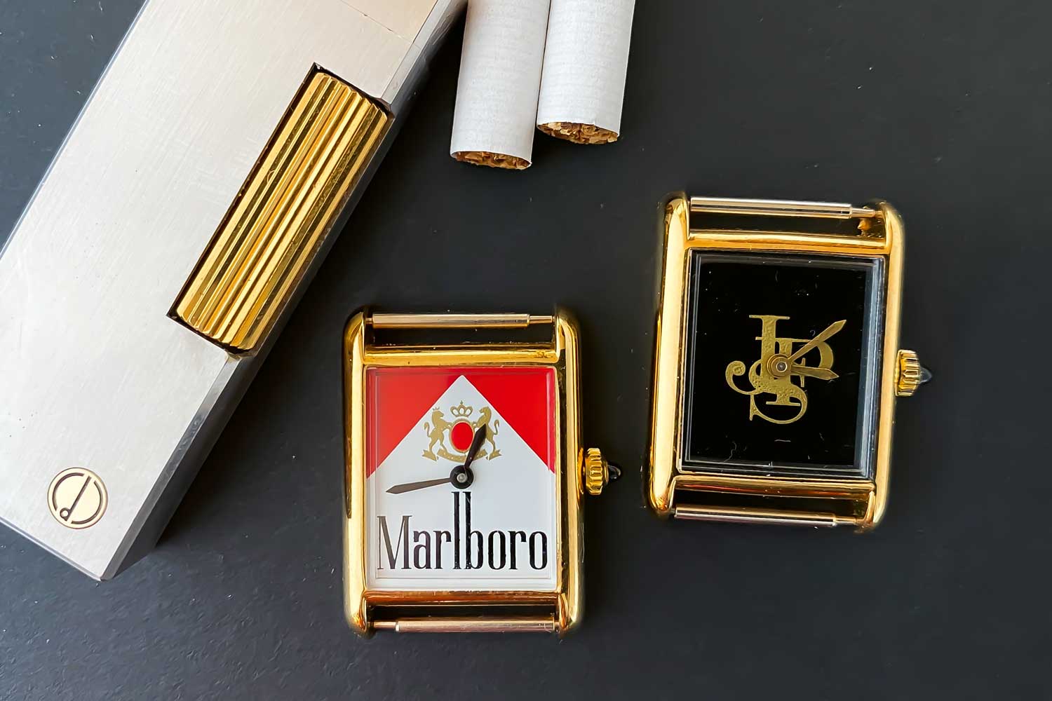 Two advertising pieces, with completely anonymous cases and movements, branded respectively Marlboro and John Player Special on the dial