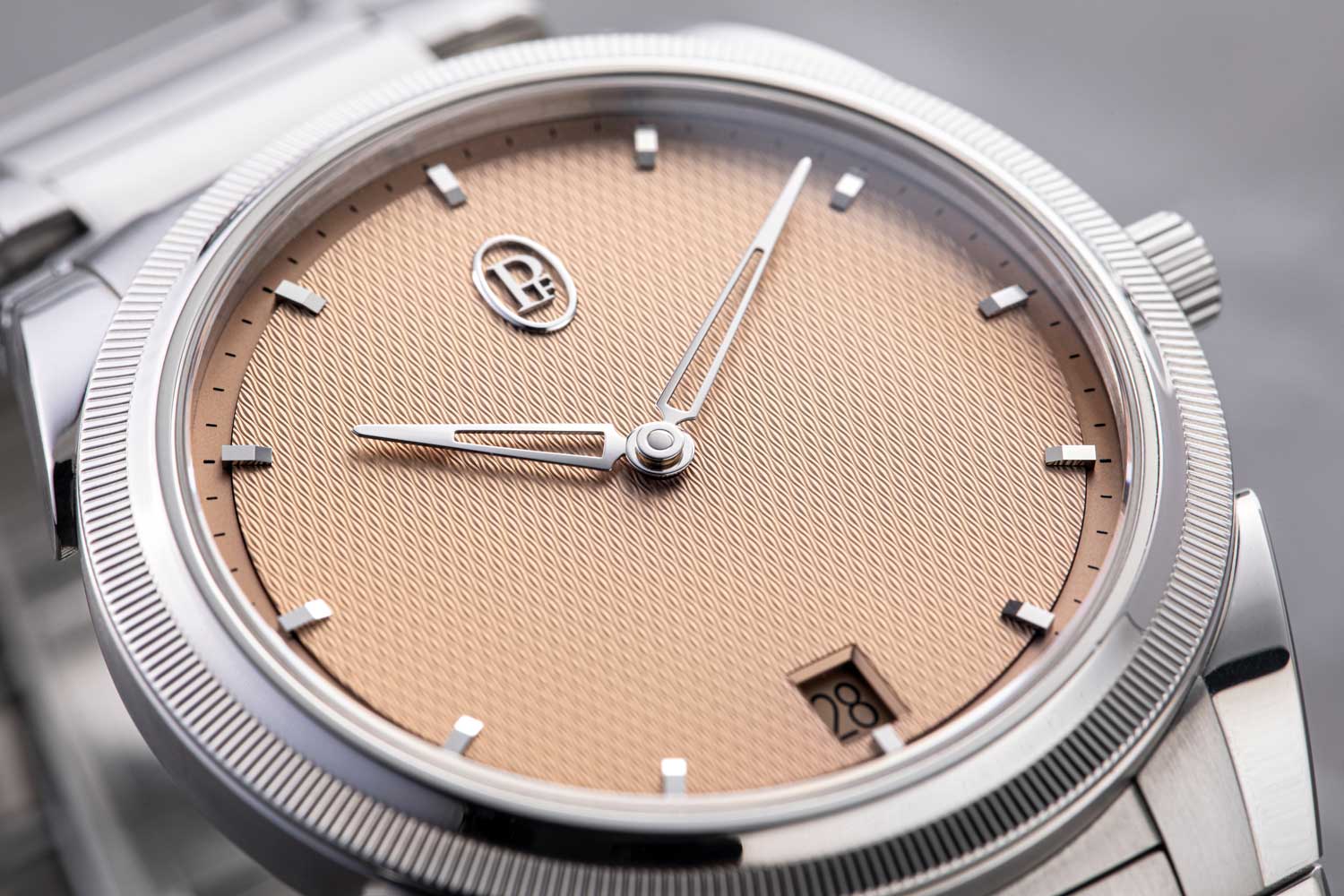 Surely a sign of its design perfection — the exquisite miniature guilloché pattern on the dial