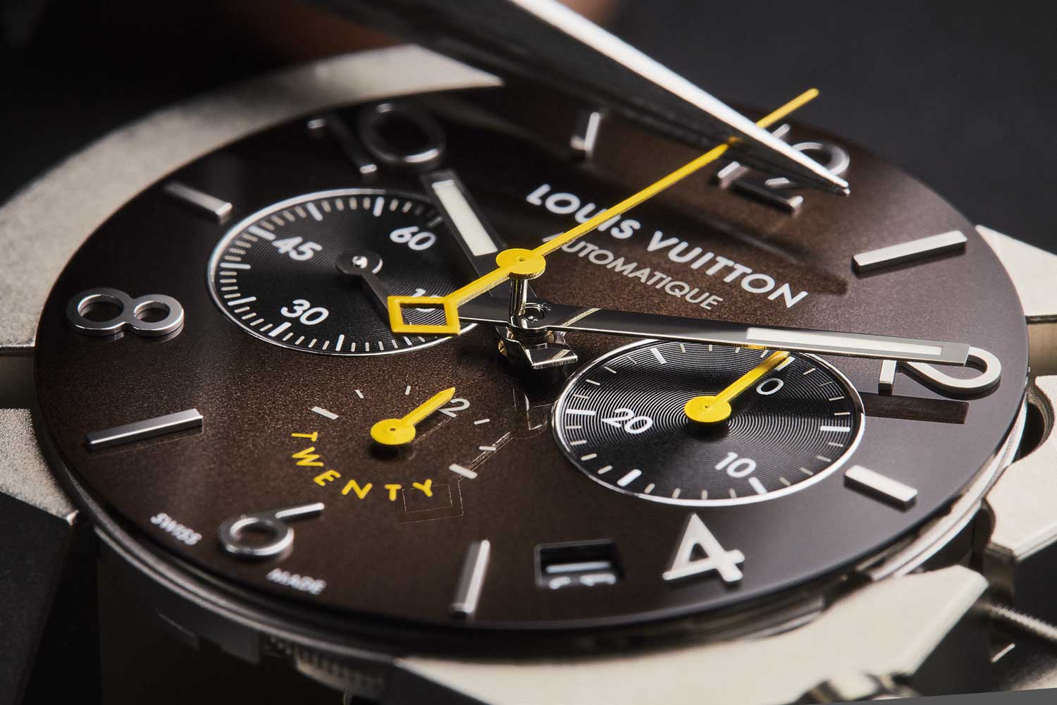 Tambout Twenty features a brown sun-brushed dial, along which the chronograph’s long yellow hand glides - a nod to the thread historically used in leatherwork