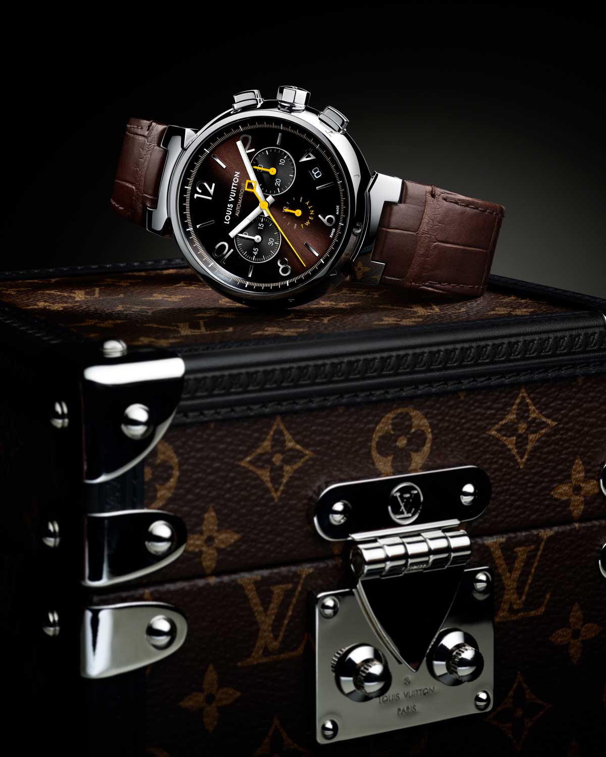 Tambour Twenty is presented in a Louis Vuitton miniature trunk with Monogram canvas as a tribute to the brand’s long history of serving clients during their travels