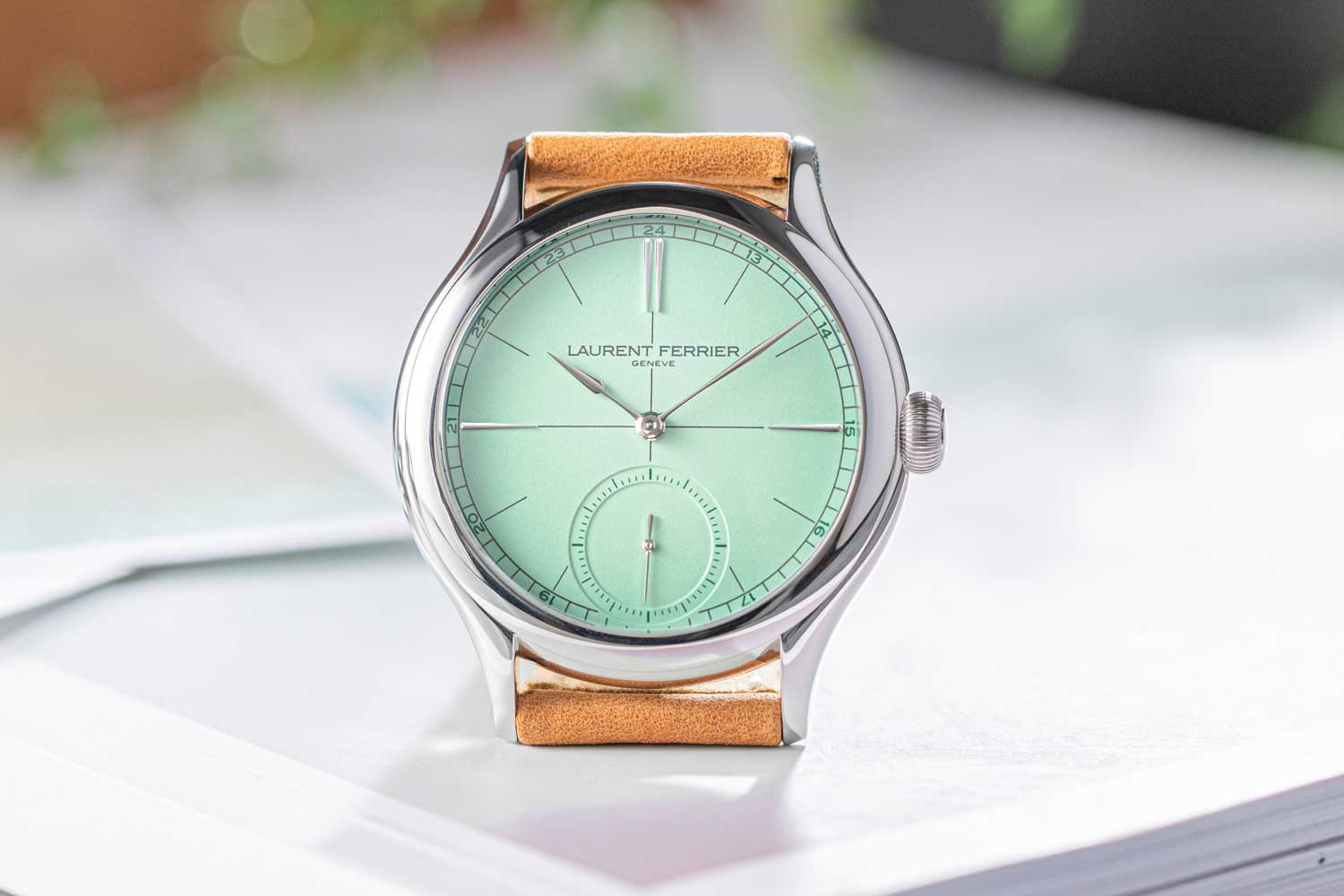 The high polished contours of the case with a pastel green gradient dial create a visually soft appearance overall (Image: Revolution©)