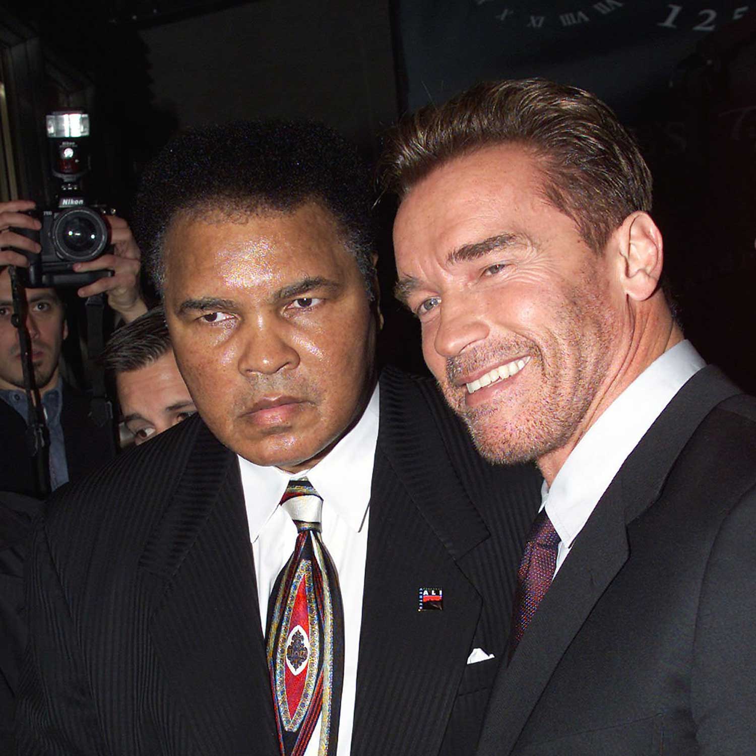 Muhammad Ali & Arnold Schwarzenegger at Audemars Piguet's Time To Give Celebrity Watch Auction For Charity, held at Christie's Auction House in New York City, 2000. (Image: Nick Elgar/ImageDirect)