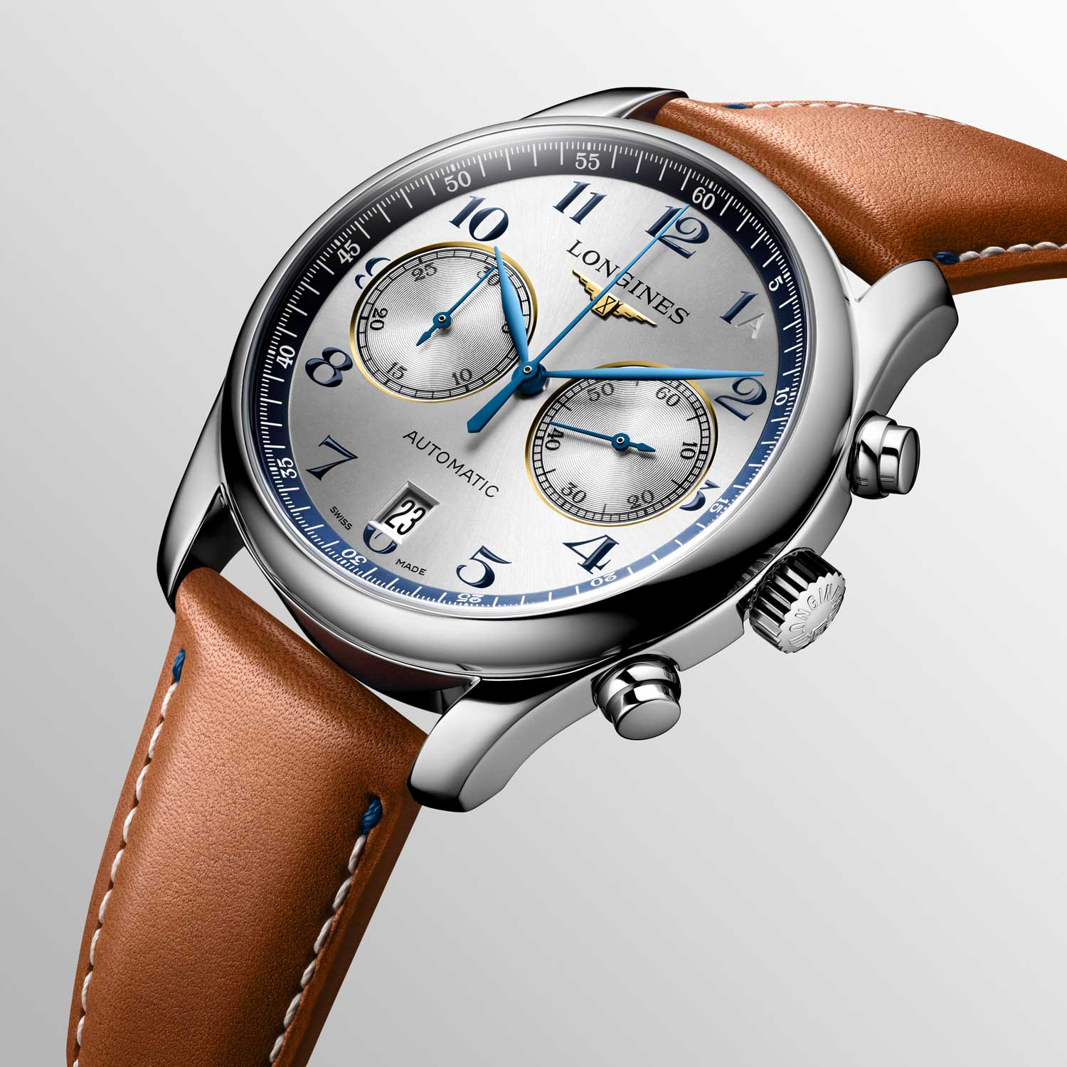 The blue Arabic numeral hour markers and hands on the watch nicely complement the blue minute track