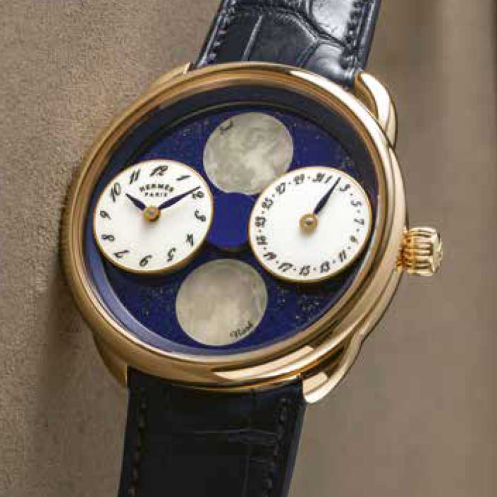 The Arceau L’Heure de la Lune features a pair of floating subdials that orbit the dial to indicate the waxing and waning of the moon in both hemispheres